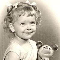 Jeri 3 years old, with Mickey Mouse doll